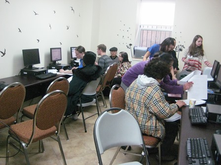 UNHP staff and student volunteers assist residents in the Serviam computer lab. 