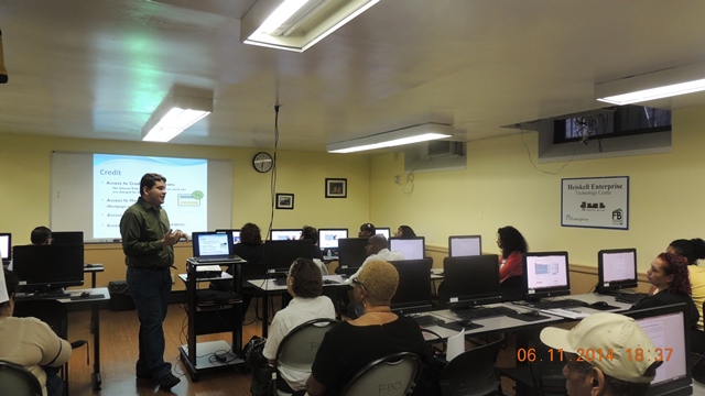 Financial Clinic Fellow, Sergio Caballero, leads a credit presentation covering credit basics, the difference between credit score and report, and ways to address credit issues. Workshop attendees were able to receive assistance printing out their credit reports after the presentation in the Heiskell Computer Lab. 