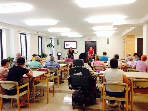 Jumelia and Nikki engage the senior residents at Rose Hill in a discussion about banking and budgeting. Citibank participated, and manager Jose Valdez provided information on affordable banking products for seniors.