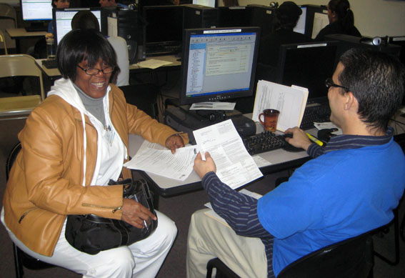 Karla (pictured here with Quality Reviewer William) and Rhonda were among the many neighborhood residents who had their taxes filed for free on February 20.