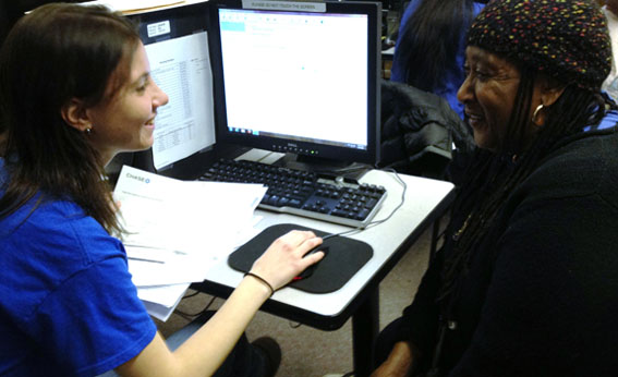 Saundra (pictured on the right) files her taxes for free with UNHP's tax preparation program. 